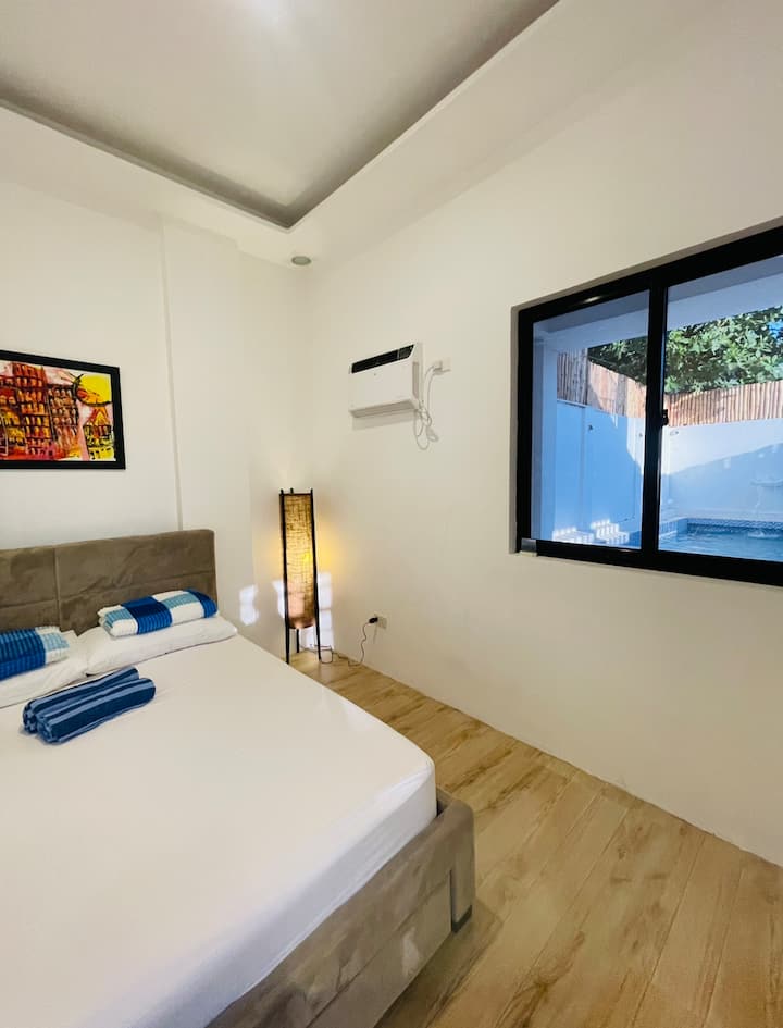 Bedroom 1 ground floor queen bed with toilet 
