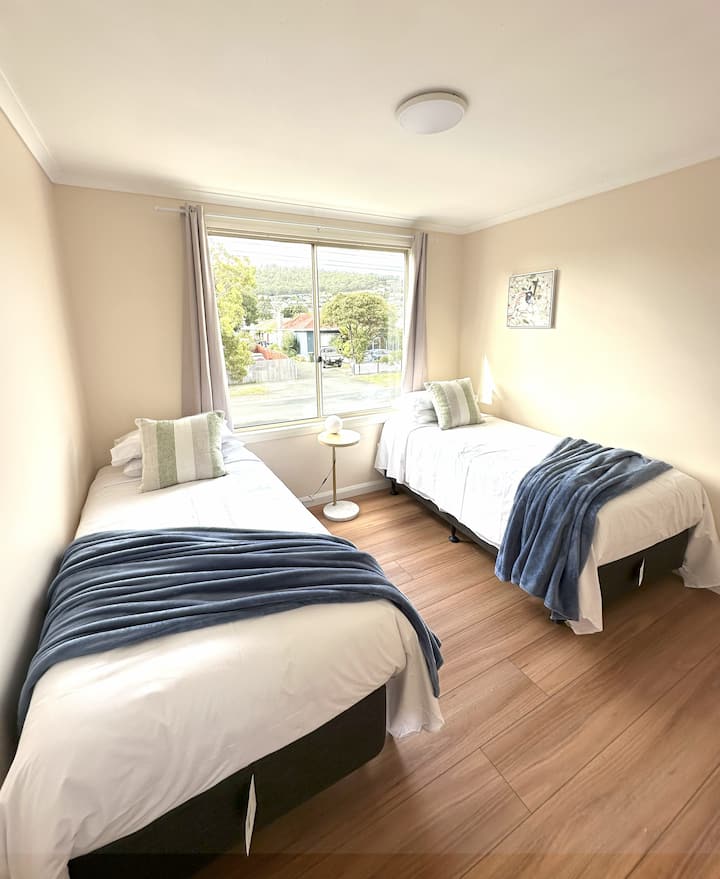 Upstair Bed Room 4 has Two Long Single beds (920mm*2030mm) accommodates 2 adults. 
Openable Window with fresh air and Mountain and garden view， 1 wireless and USB phone charging station, dimmable light.