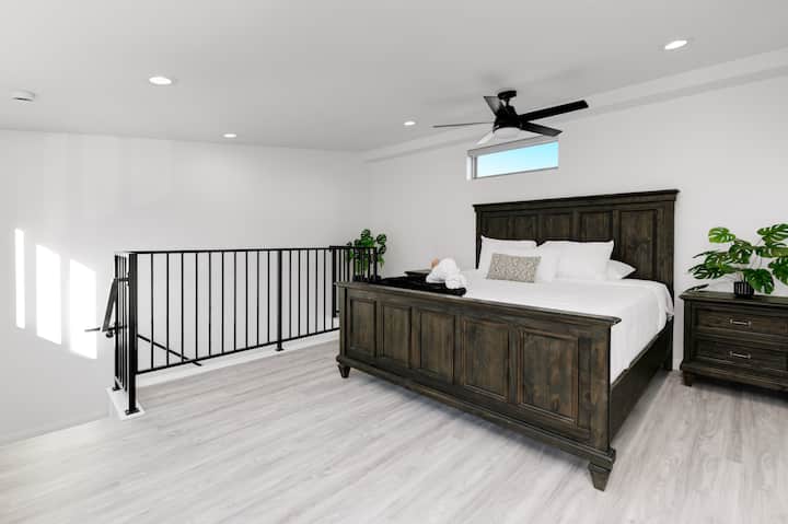 Master Suite 1 (New Two-Story Addition). 800 sq ft in total. 
Downstairs: TV sitting area and a high-quality couch bed that sleeps two (with a real mattress).
Upstairs: King bedroom with a TV.  Private en-suite bathroom.  Room locks for privacy.