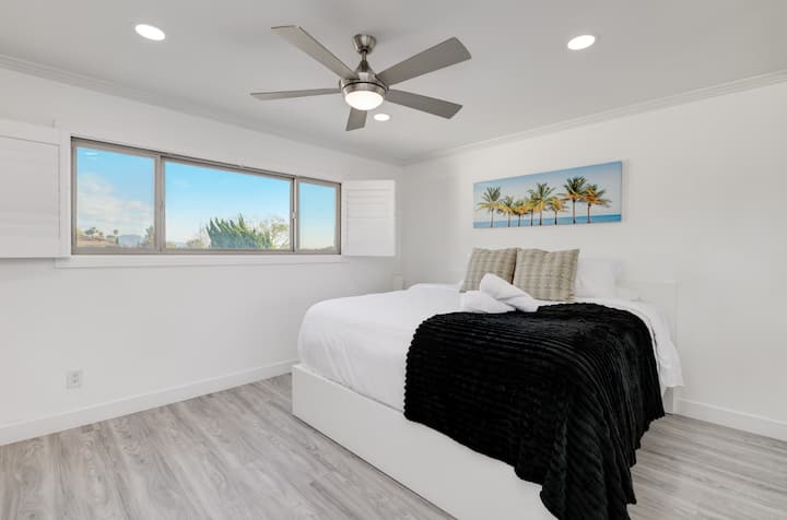 Master bedroom with king bed and private bathroom. 