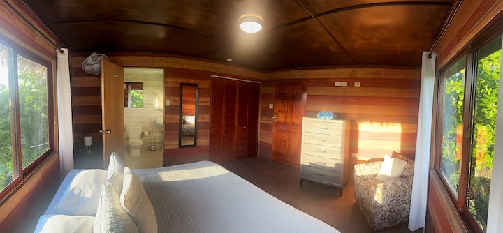 Large windows overlook tropical trees. Spacious with Air conditioning and your own en-suite bathroom