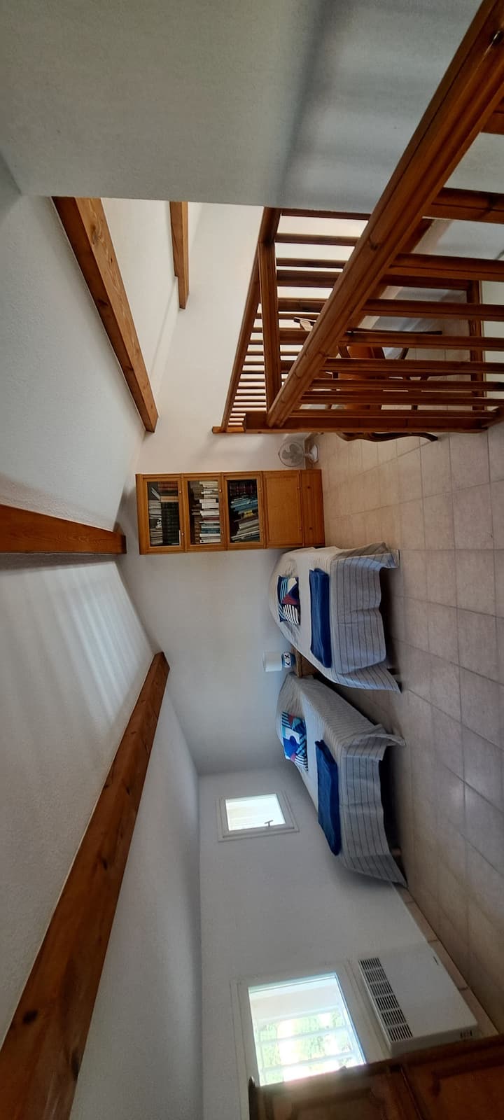 large mezzanine with a bedroom area and another desk 