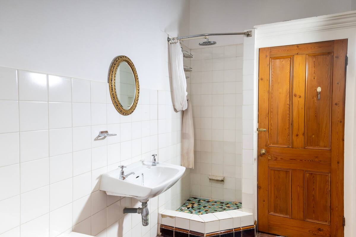 Shared bathroom with shower next to the poolside room at Utopia, Fresnaye