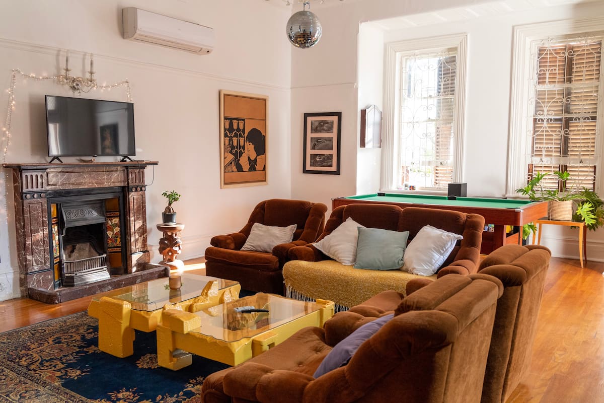 Shared lounge with pool table at the Utopia co-living mansion in Cape Town