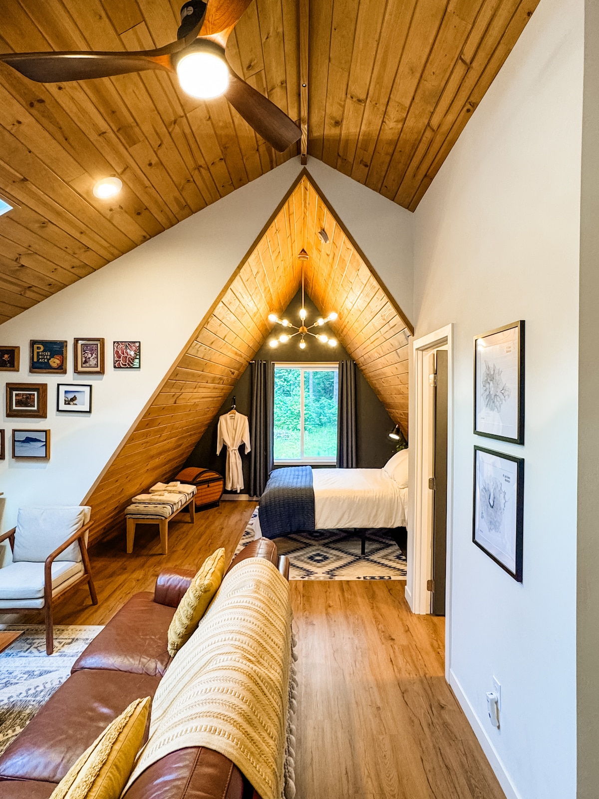 Just off the loft is a queen bedroom featuring a comfortable, medium-plush mattress and soft, cotton bedding, offering tranquil, private spaces to unwind and recharge. A second bathroom is upstairs as well.