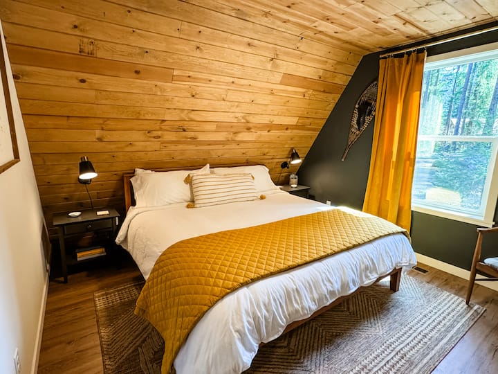 Two private king bedrooms are located on the first floor. Each room features comfortable, medium-plush mattresses and soft, cotton bedding, offering tranquil, private spaces to unwind and recharge.