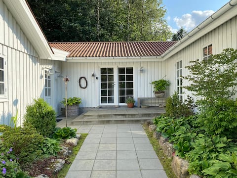 Idyllically situated wooden house by the forest