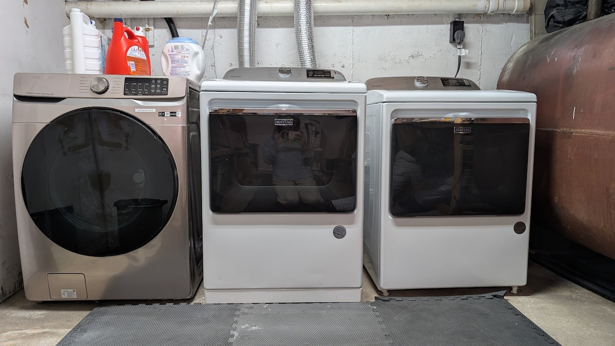 Laundry room with washer and dryers