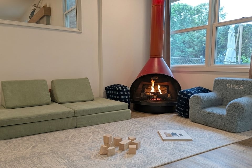 Sunroom — play area and fireplace