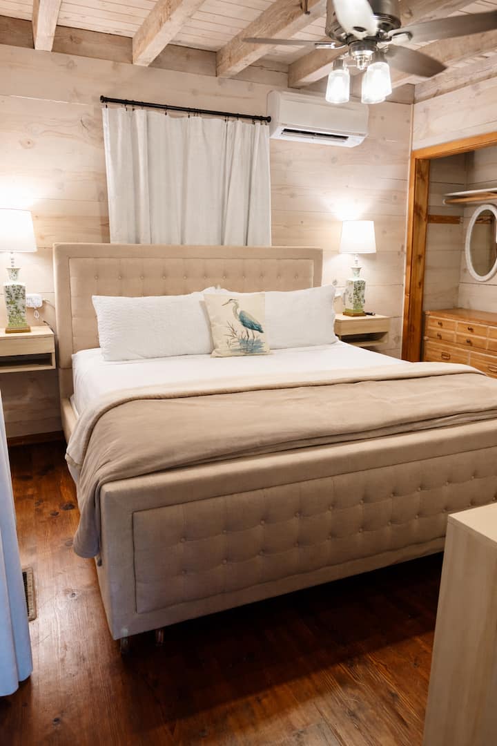 Downstairs bedroom.  King sized bed, blackout curtains, additional pillows and blankets available.