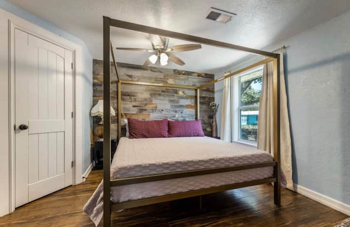 Second bedroom with queen bed and beautiful shiplap accent wall.
