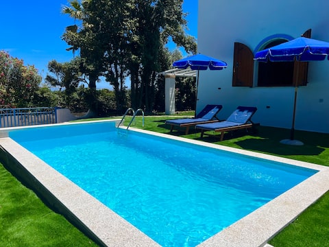 Villa with pool in front of the beach