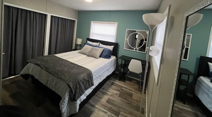 Includes:
Queen bed
Fan
Full length mirror 
Desk & chair
Side table & lamp
Floor lamp 
Closet space with hangers, clothes hamper, and shelf
TV with Fire Stick 
Dresser with three drawers
Attached half bath