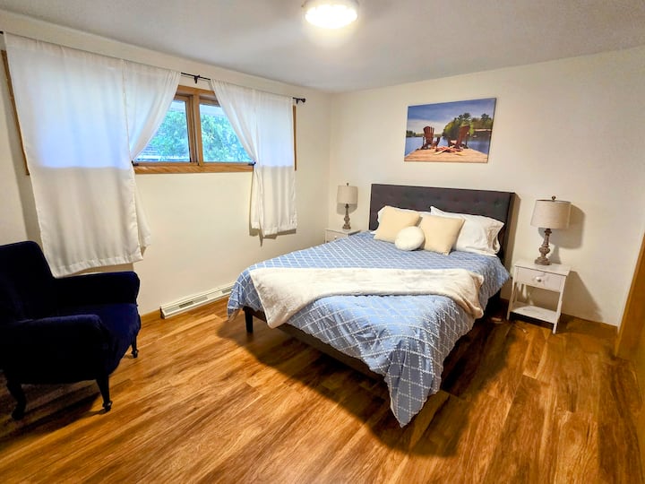 Queen bedroom with plenty of space, comfy bedding and closet.