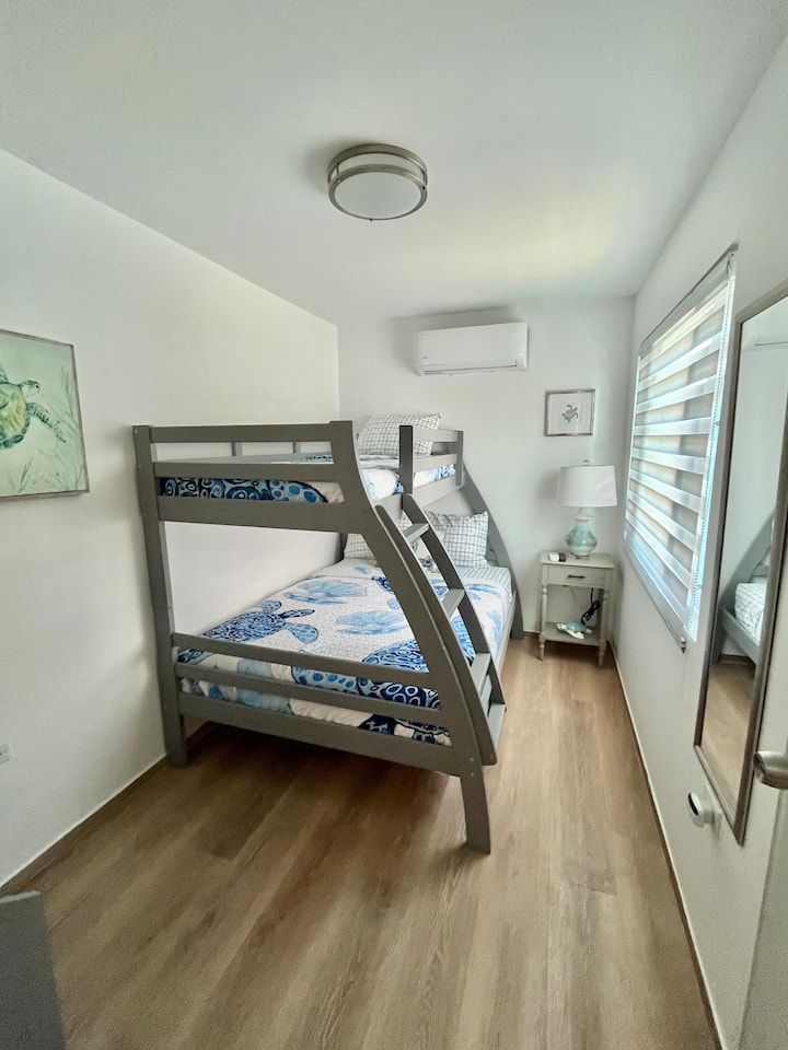 Sea turtle themed room, top twin bed, full bottom bed.