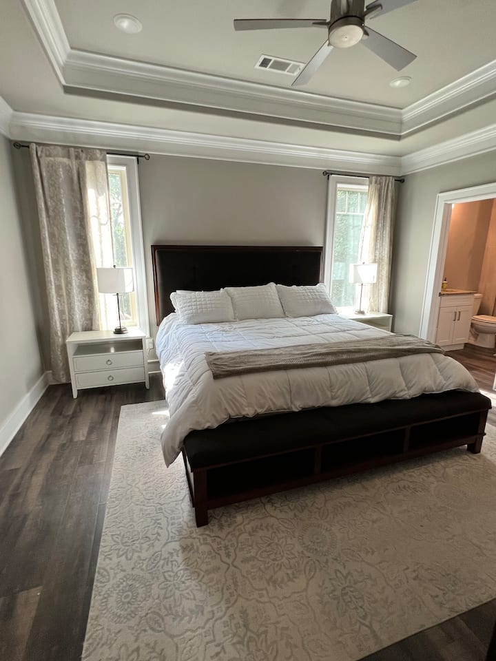 Big master with tv and king bed.  Walk in closet and adjoining full bathroom. 