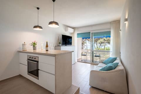 “Sunset Serenity: Designer Loft with Sea View”