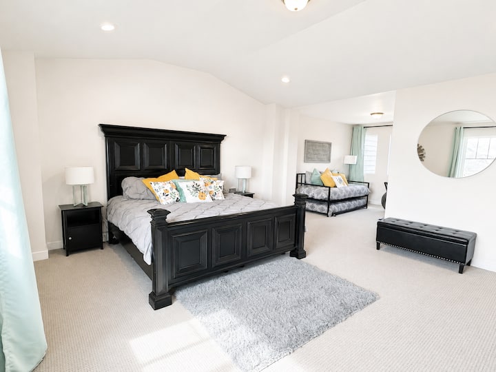 Large master bedroom with King size bed, loft, and amazing mountain and lake views.