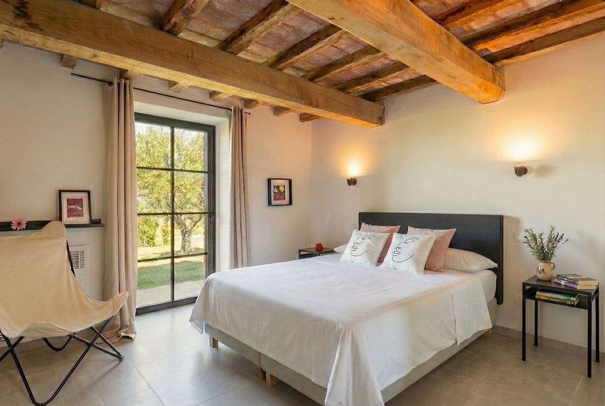 Bedroom 4 at Poggio alla Famina, bright with countryside views