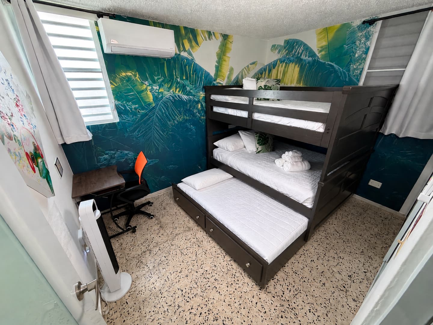 Frog Room with full-size bunk beds and tropical mural at Tropical Enchant