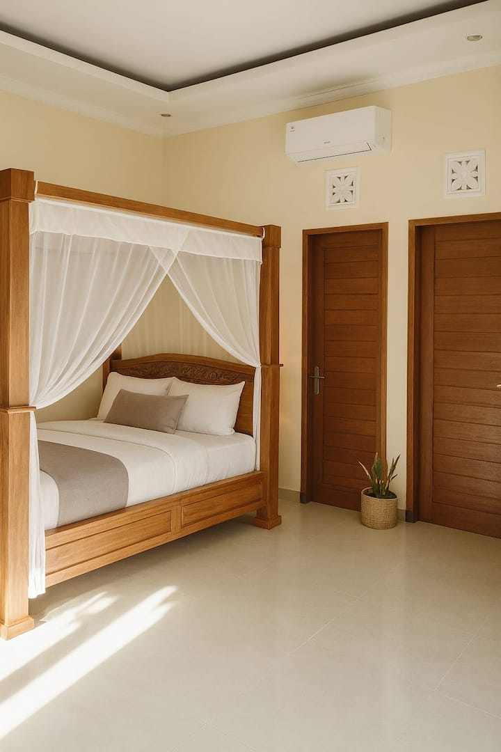 Follow the secure private walkway to a second gated entrance where two friendly Balinese statues greet you. Step inside to a safe, spacious tropical garden—perfect for children to explore and families to unwind