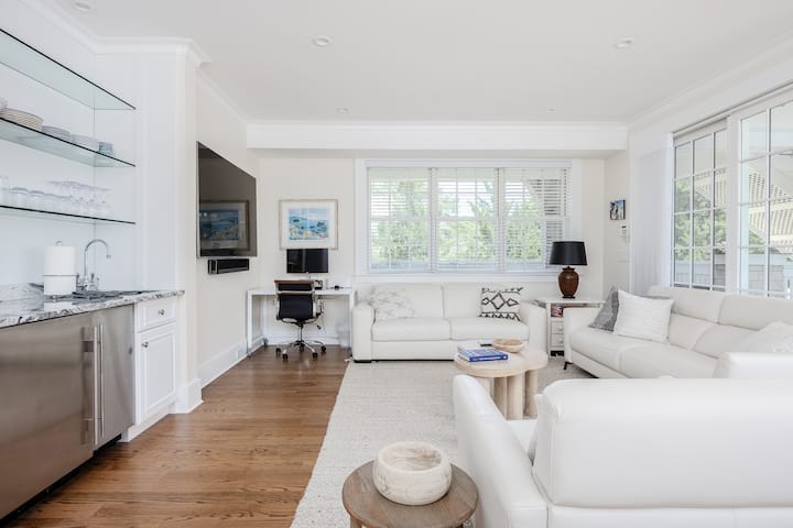 This living room converts into a full private bedroom with pull out couch and adjacent full bathroom.  This is located right off the outdoor conversation pit area which leads to the pool!