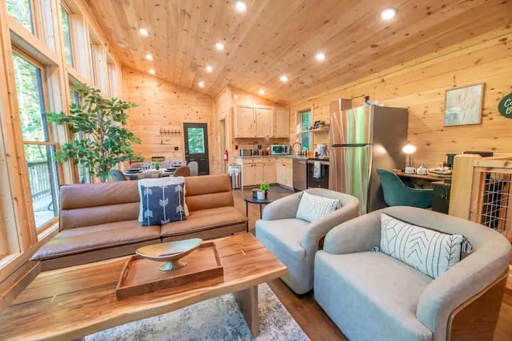 hen.

The open-concept living and dining area is designed for relaxation and enjoying the views