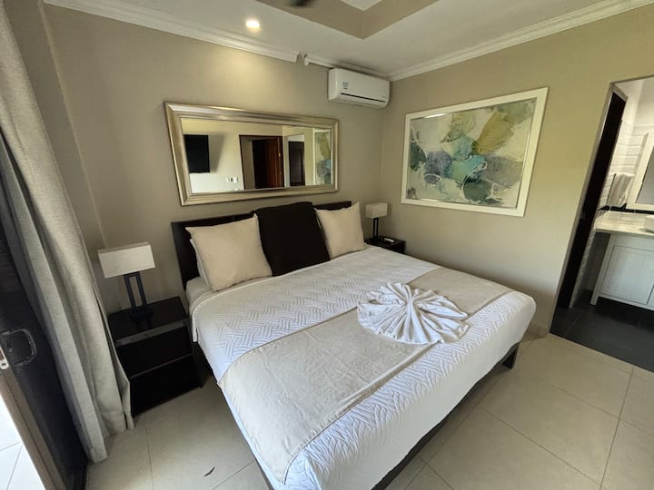 Master bedroom with ensuite bathroom and private balcony