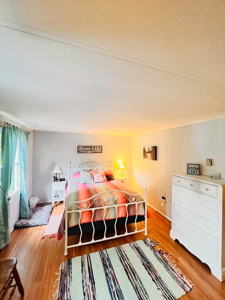 Bedroom #3- main bedroom with a comfy queen bed, lake views, and it's own bathroom