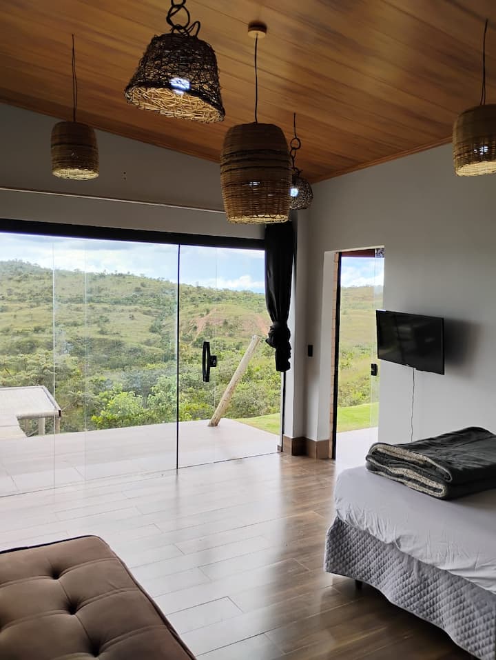 Bedroom with TV, air conditioning and bathroom
