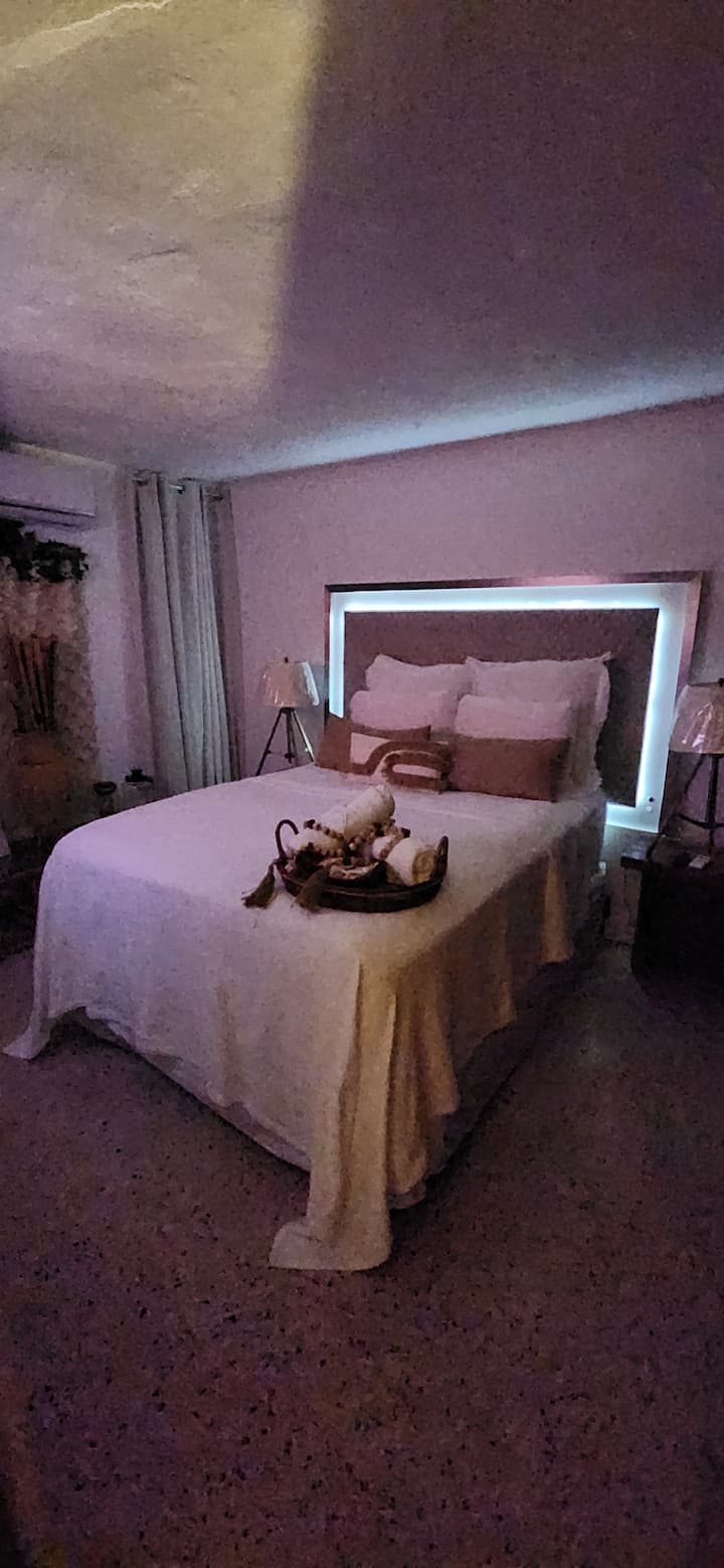 bedroom With TV Air conditioning with a queen bed...
