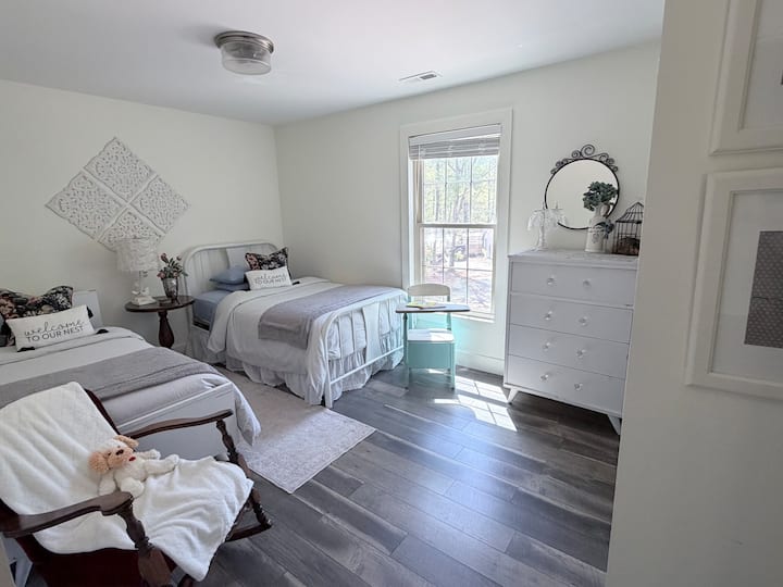This bedroom has a twin and full-size bed. A blowup bed that is available for guests if needed. This light and bright, comfy bedroom is a perfect space for extra guests or kids.  We like to change the linens for fun new looks.