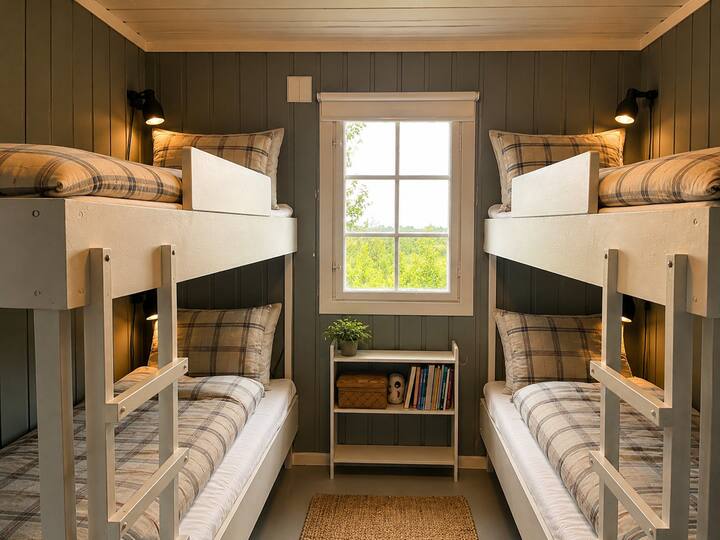 Two single bunk beds in a small but modern bedroom