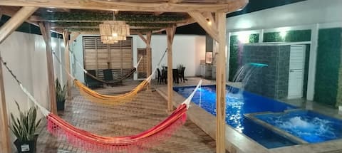 House with a swimming pool and beach access