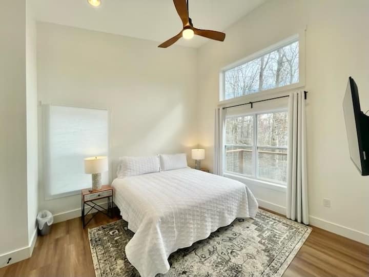 Primary suite with king bed, 50” HDTV, full bath and laundry room. View the stars from bed on a clear night. 