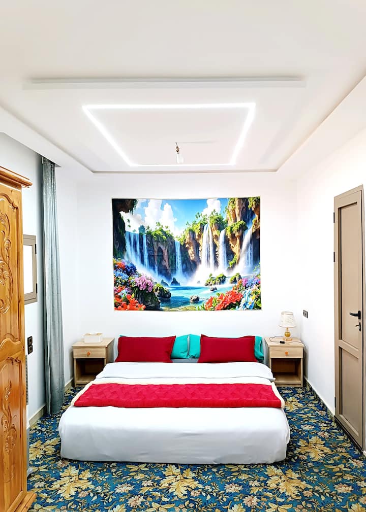 Aziz Royal Suite: Flexible Luxury (5 Guests + Baby)
Moroccan decor & private bath. We offer flexible bed setups (King/Single) & a baby crib on request. Personalized comfort by Aziz’s imprint