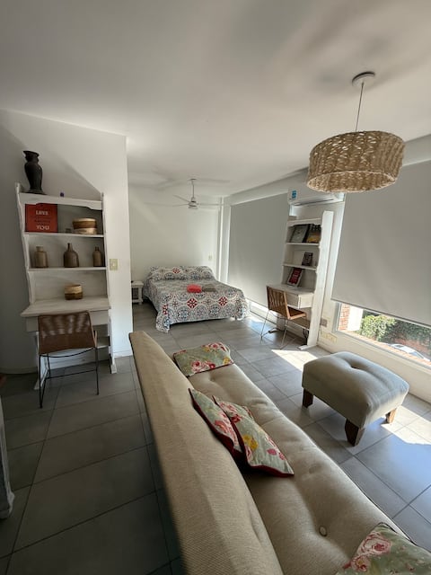 A bright studio in the center with a BIS garage