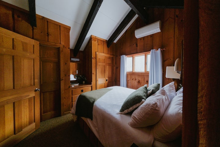 Queen size bedroom that is located upstairs that has split unit heated/AC, two closets, and private door to upstairs bathroom. 