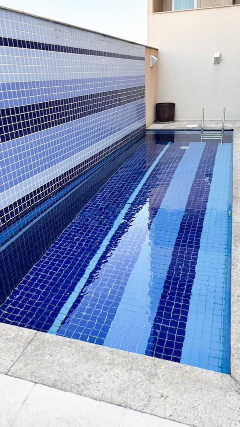 Studio with pool and air conditioning - 15 minutes from Galeão