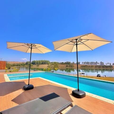 Canastra Sunset. Modern house, new, standing on the water.