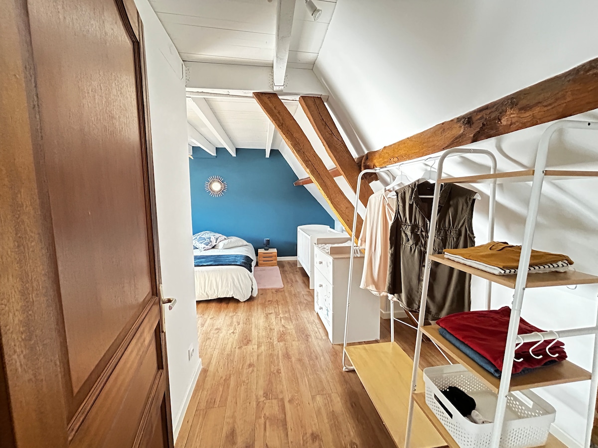 Large master bedroom with 160 x 200 queen size bed;
An armchair;
A wardrobe/shelf; 
A crib;
A dresser with a changing table.