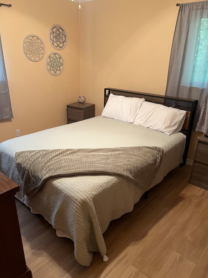 Queen bed with 32 inch Roku TV to stream any service you subscribe to.