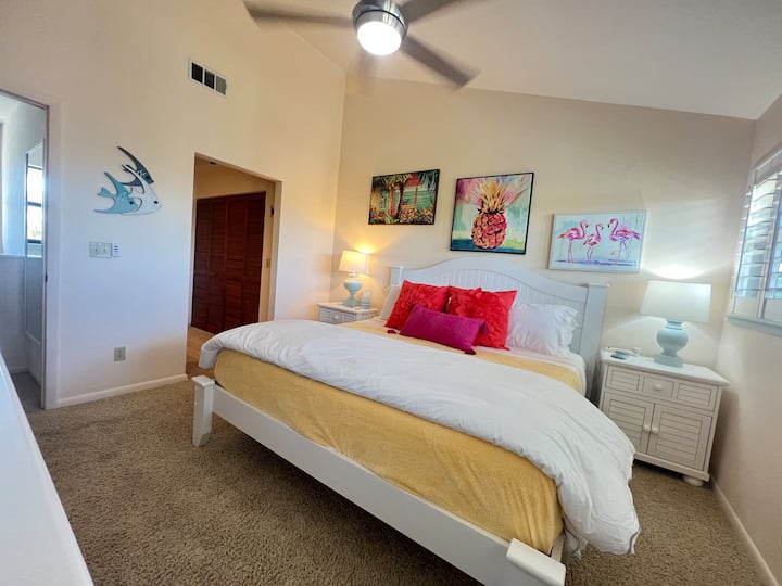 Bedroom number 1.  Located on the upper floor with a King size bed, full Dressor, 2 night stands and a bathroom with shower.  Wall mounted smart TV is also in this bedroom.