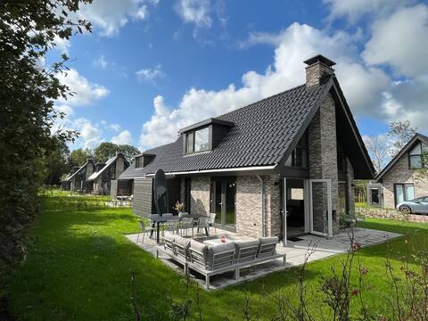 Holiday villa on Fluessenmeer, possibly with sloop