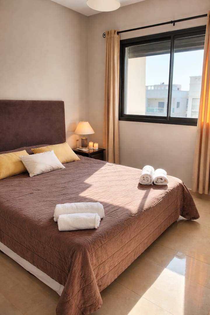 A cozy and bright bedroom 
Perfect for relaxing in peace, with a comfortable bed and a soft and soothing atmosphere.