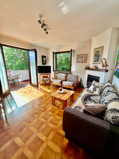 The house in the woods in Casasco with lake view