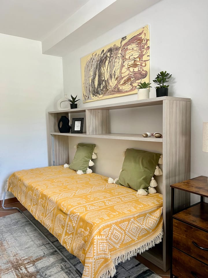 The Murphy bed is in the studio workspace next to the Master Bedroom on the lower level.