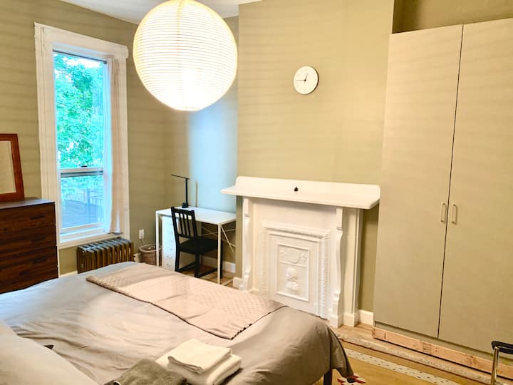 one king size bed with table/ chest drawer and closet unit.  Facing to a rear garden.