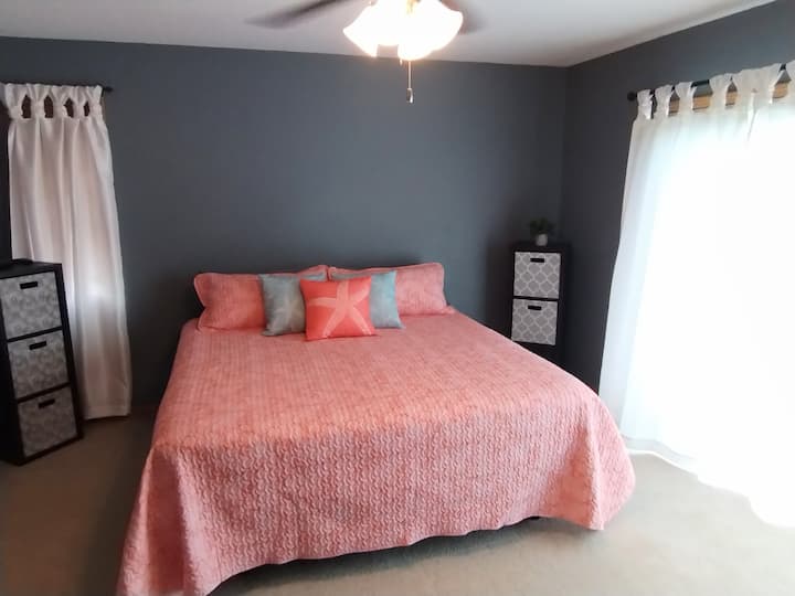 Master bedroom including king size bed on adjustable frame with massage mode.