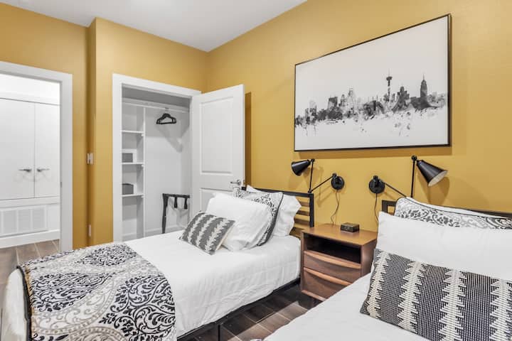 Two twins in the 3rd bedroom and a San Antonio skyline art piece.